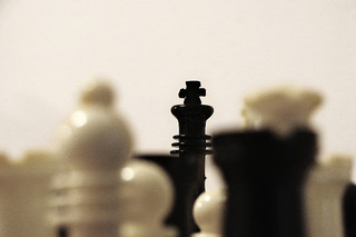 Black King Chess piece among others in the board